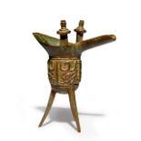 A small Chinese archaistic ritual pouring vessel, jue, Ming dynasty, standing on three blade-shap...