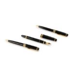 Montblanc. A set comprising fountain pen, rollerball pen and pencil, all in black resin, with gil...