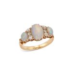 An early 20th century opal and diamond ring, composed of three graduated oval-shaped opal cabocho...