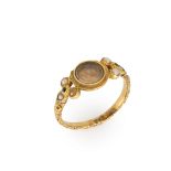 A mid Victorian gold locket ring, cover deficient, composed of a central circular glazed panel, t...