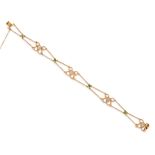 An Art Nouveau 15ct gold gem-set bracelet, composed of openwork scrolled panels, each set with a ...
