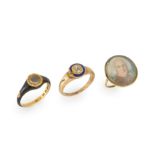 A group of three 19th century rings, comprising: a Victorian 18ct gold mourning ring, composed of...