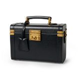 Gucci. Padlock vanity case, of black calfskin exterior and canvas interior, with gold-toned hard...