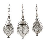 Italian  Three cage blown lanterns, early 20th century  Wrought iron, glass  Largest : 60cm