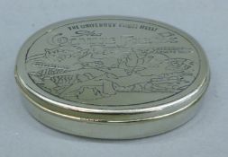 An oval 'cocaine' tin. 10 cm wide.