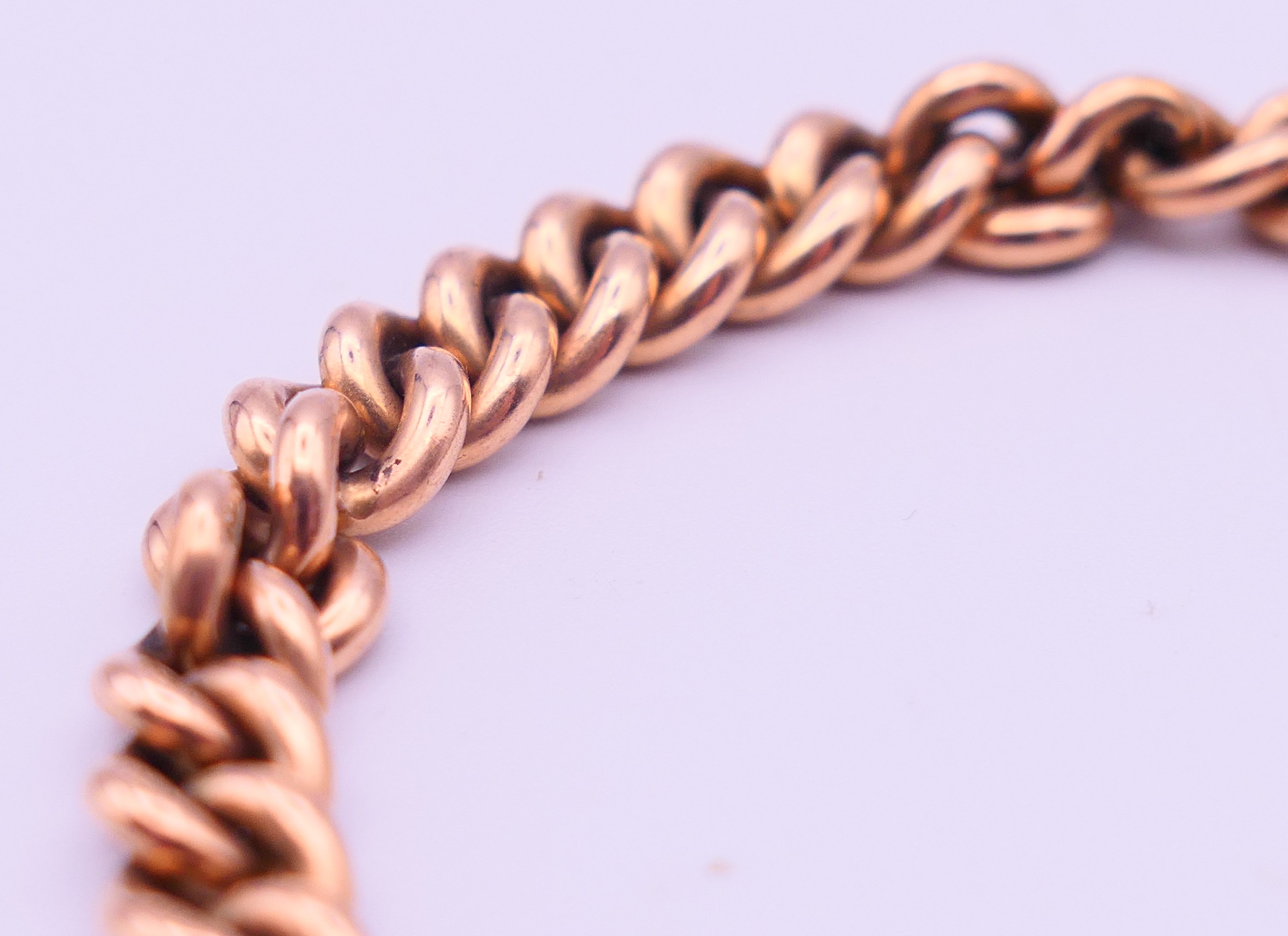 A 9 ct gold bracelet with padlock fastening. 19 cm long. 27.5 grammes. - Image 3 of 5