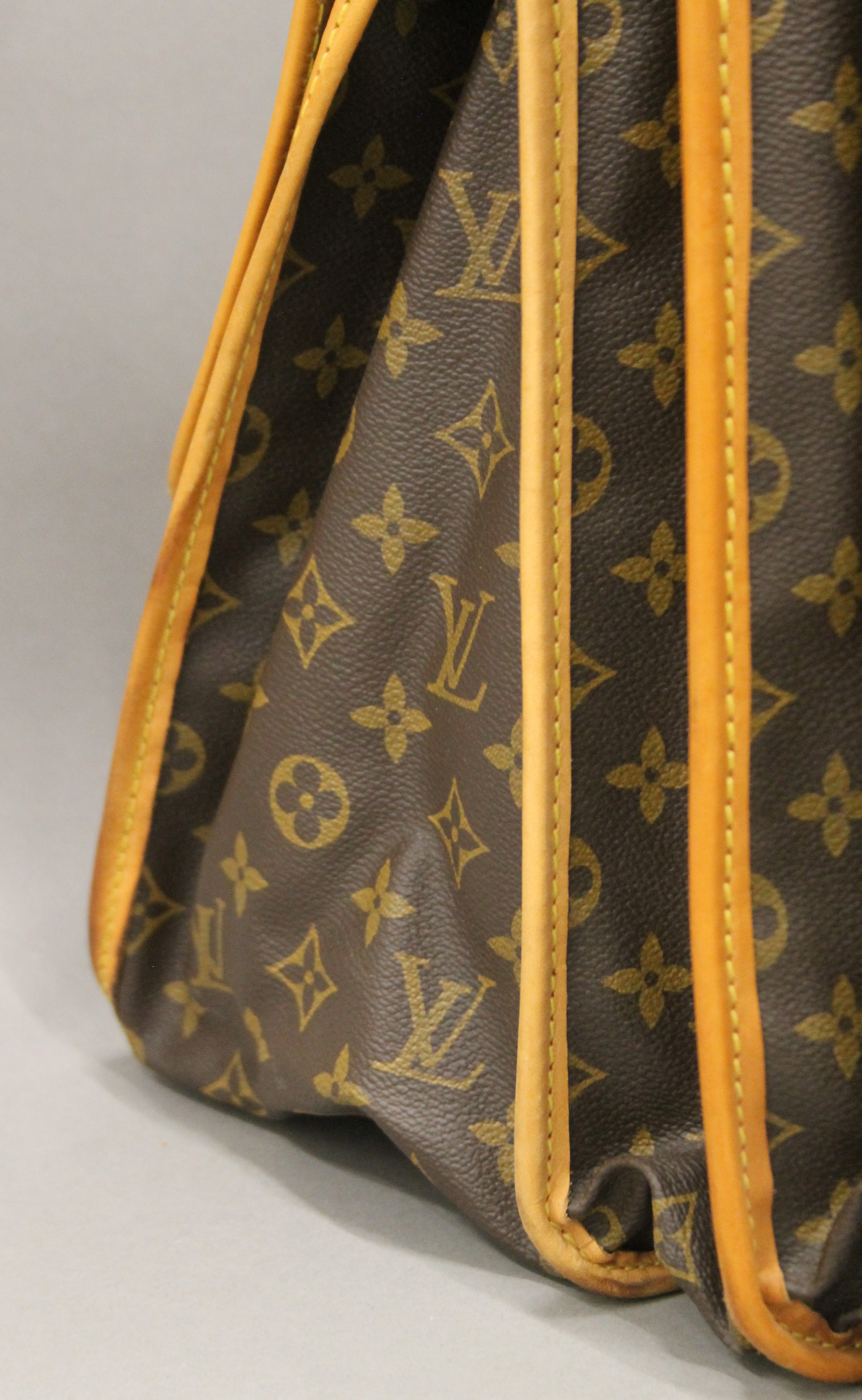 A vintage 1980's Louis Vuitton three-pocket travel bag with leather trim and shoulder strap. - Image 4 of 16