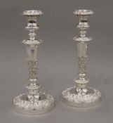 A pair of Sheffield plate candlesticks. 28 cm high.