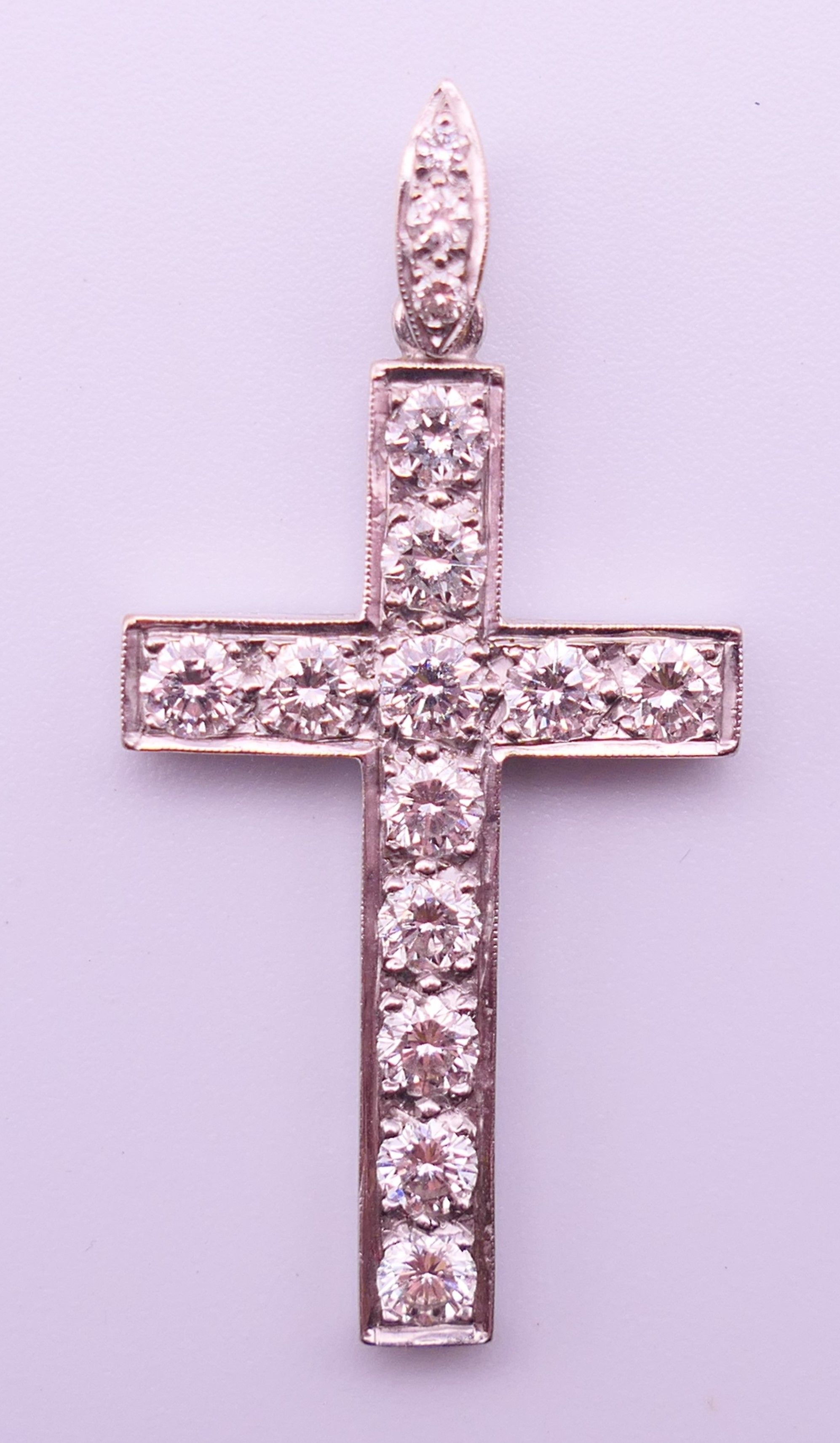 An unmarked white gold or platinum diamond set cross pendant. 4 cm high including suspension loop. - Image 3 of 3