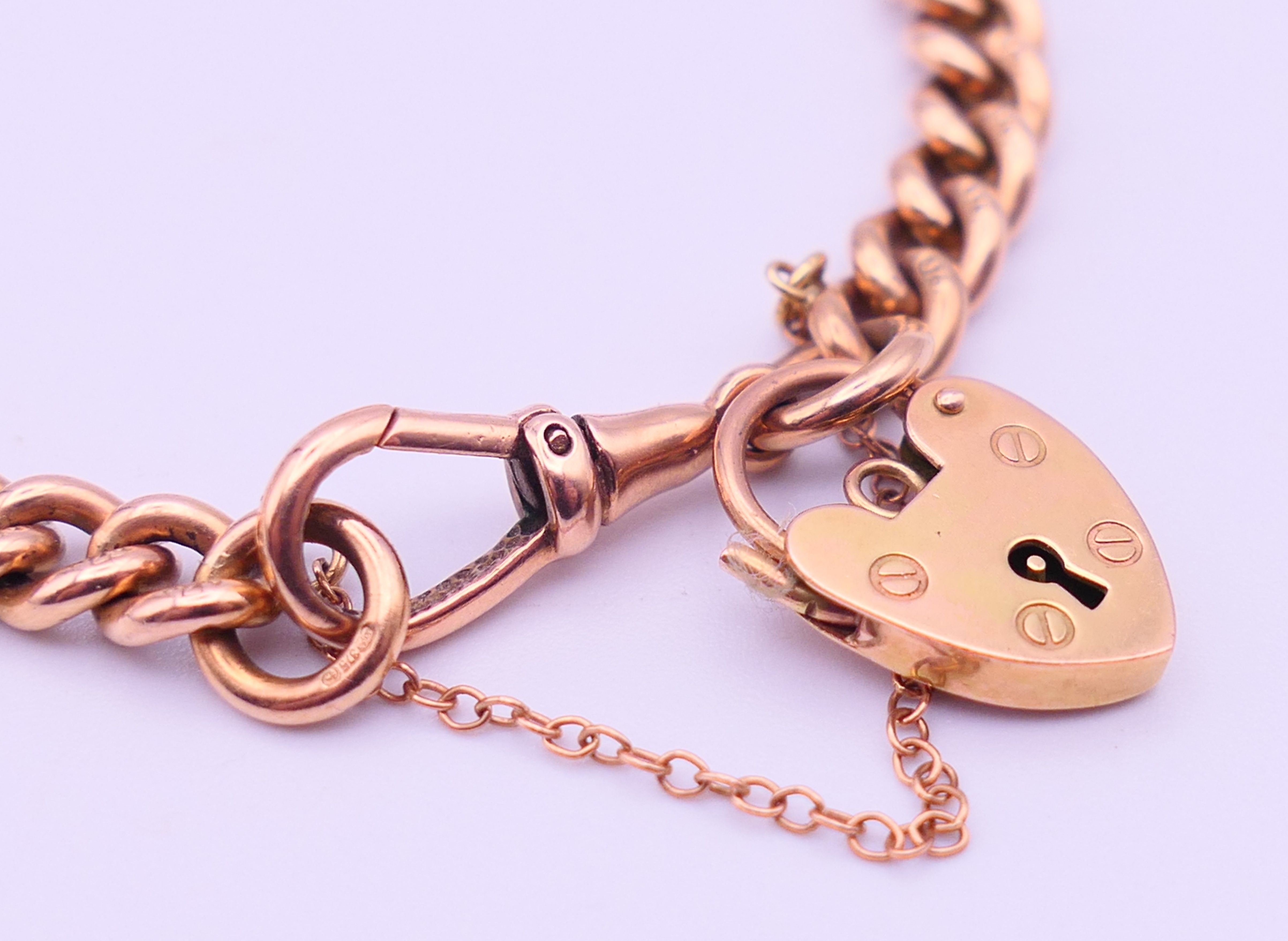 A 9 ct gold bracelet with padlock fastening. 19 cm long. 27.5 grammes. - Image 2 of 5