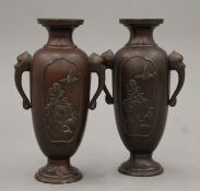 A pair of Meiji period Japanese bronze vases. Each 17.5 cm high.