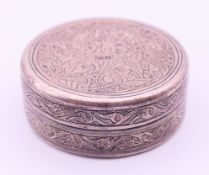 An Egyptian silver lidded box. 4.5 cm diameter.