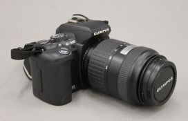 An Olympus E500 digital camera in case. The case 18 cm wide.