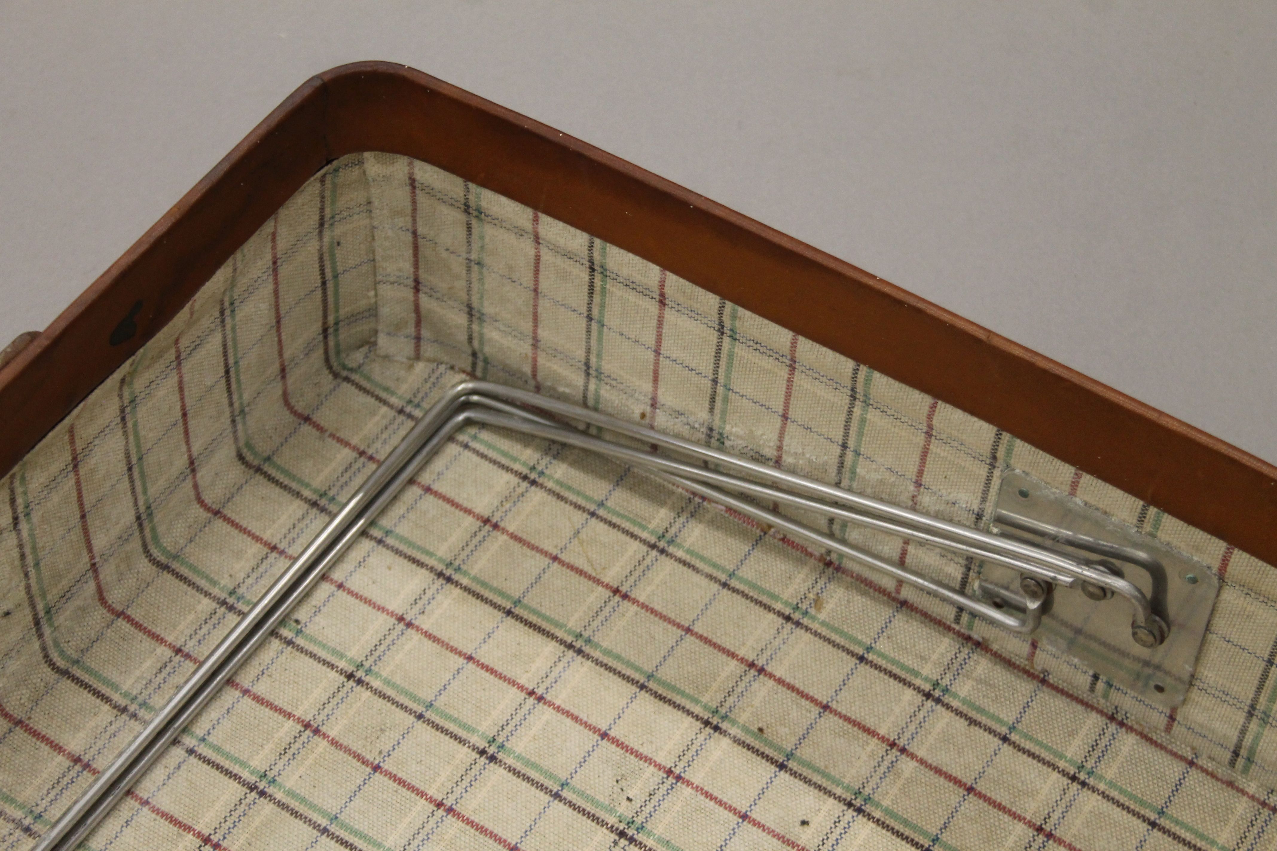 A vintage leather suitcase with some old travel labels. 55 cm wide. - Image 7 of 7