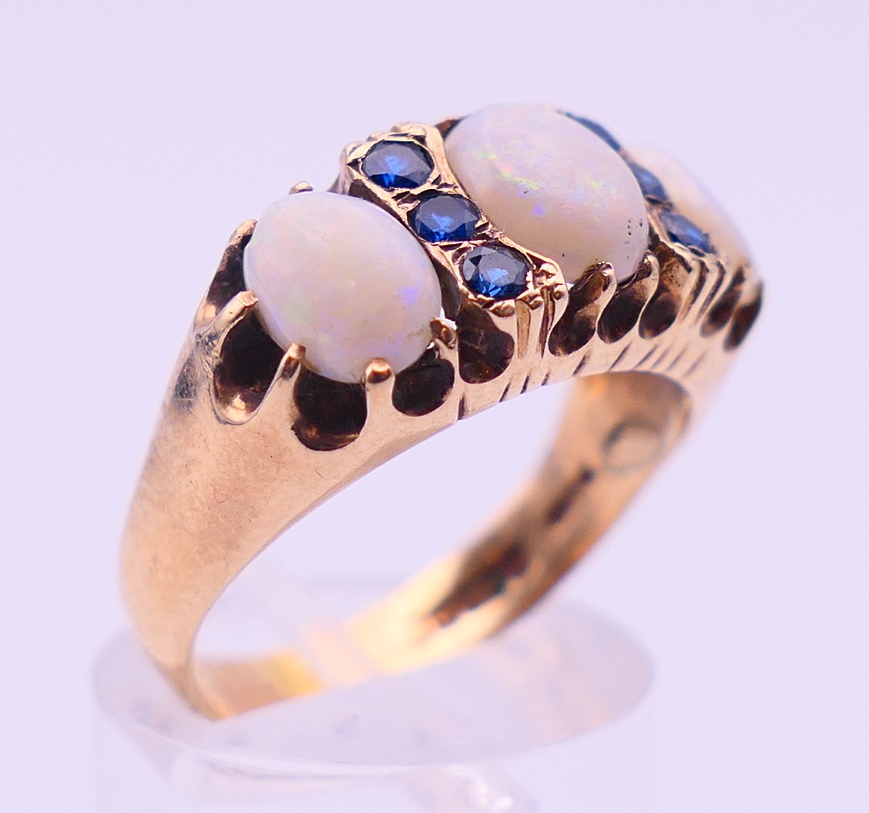 A 9 ct gold, opal and sapphire ring. Ring size Q. 4.8 grammes total weight. - Image 3 of 5