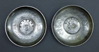 A pair of Chinese coin dishes. Each 9 cm diameter.