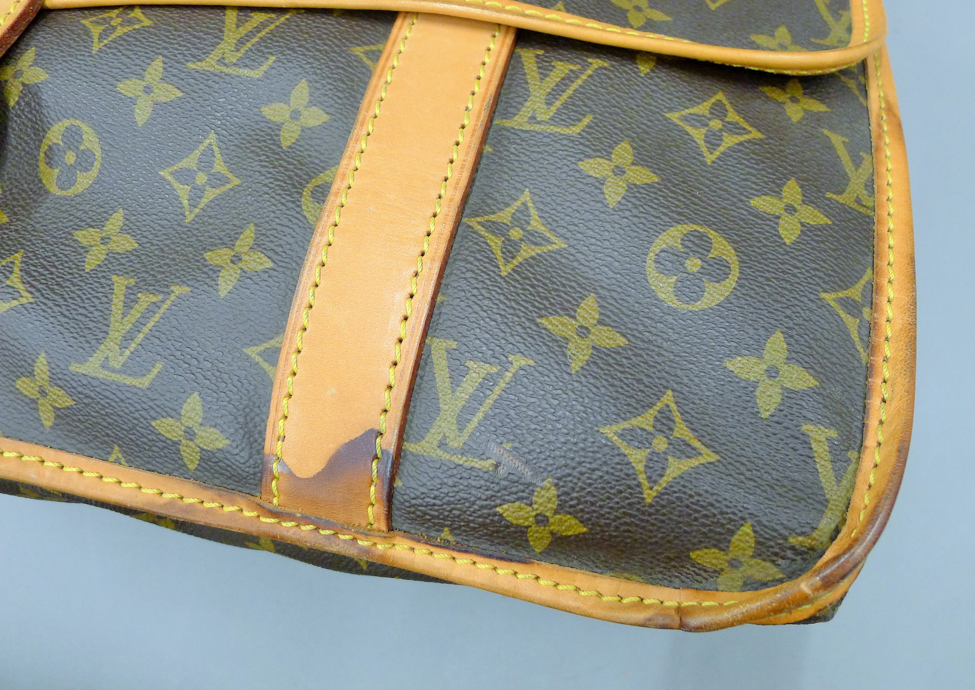 A vintage 1980's Louis Vuitton three-pocket travel bag with leather trim and shoulder strap. - Image 11 of 16