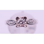 A 9 ct white gold and 0.20 carat diamond ring. Ring size N/O. 2.9 grammes total weight.