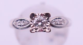 A 9 ct white gold and 0.20 carat diamond ring. Ring size N/O. 2.9 grammes total weight.