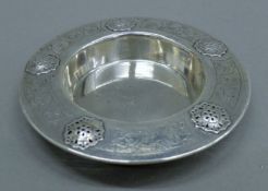 An unmarked Eastern silver dish. 14 cm diameter. 120 grammes.