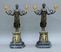 A pair of bronze Empire-style twin-branch candelabra. 52 cm high.