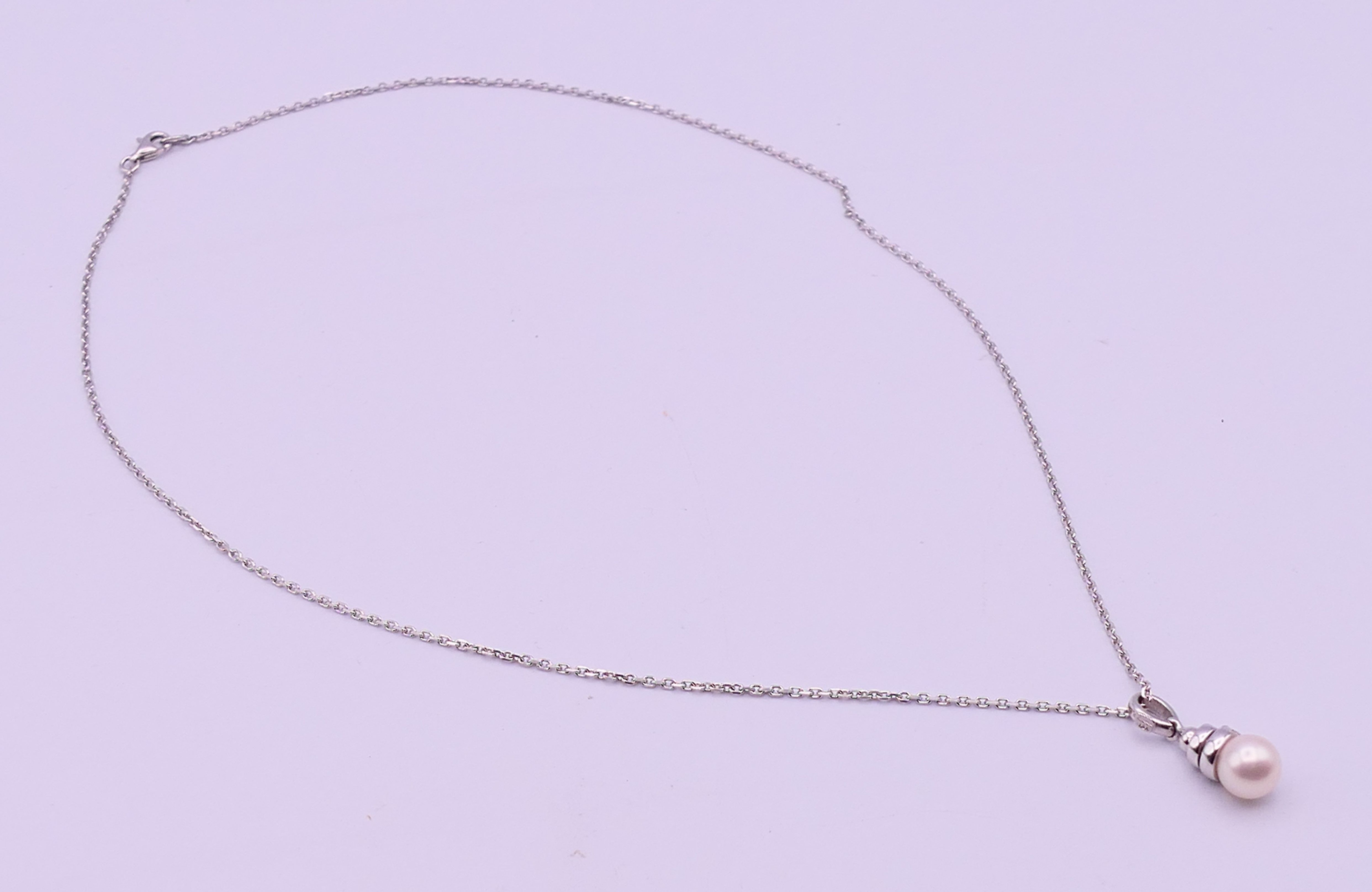 An 18 ct white gold, diamond and pearl drop pendant on a chain. Pendant 2. - Image 3 of 6