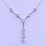 A 9 ct white gold and diamond pendant necklace. Pendant drop 3 cm high, chain 45 cm long. 3.