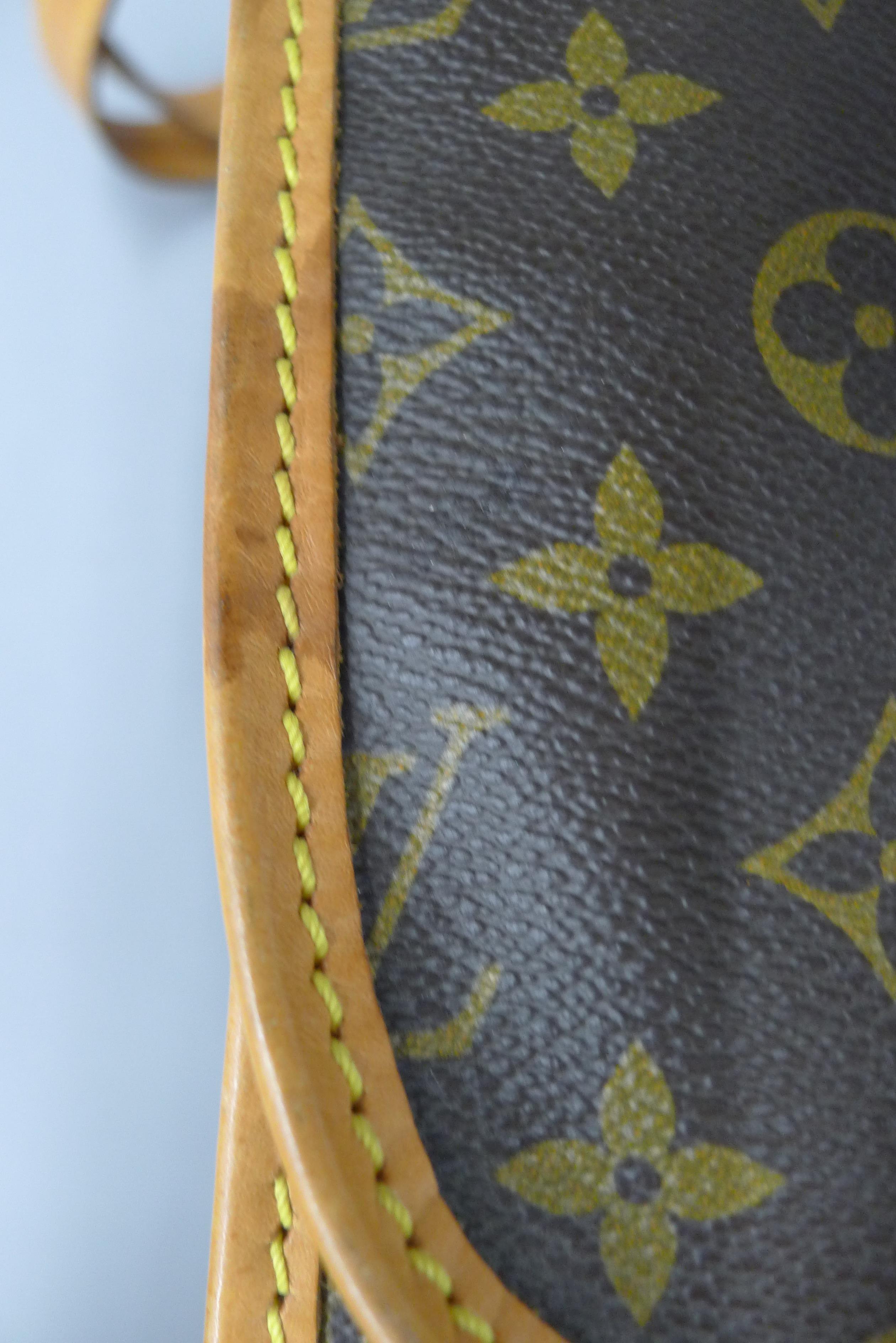 A vintage 1980's Louis Vuitton three-pocket travel bag with leather trim and shoulder strap. - Image 12 of 16