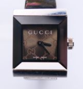 A Gucci ladies' stainless steel bracelet wristwatch, reference 128.