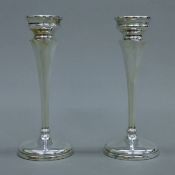 A pair of silver candlesticks. Each 17 cm high.