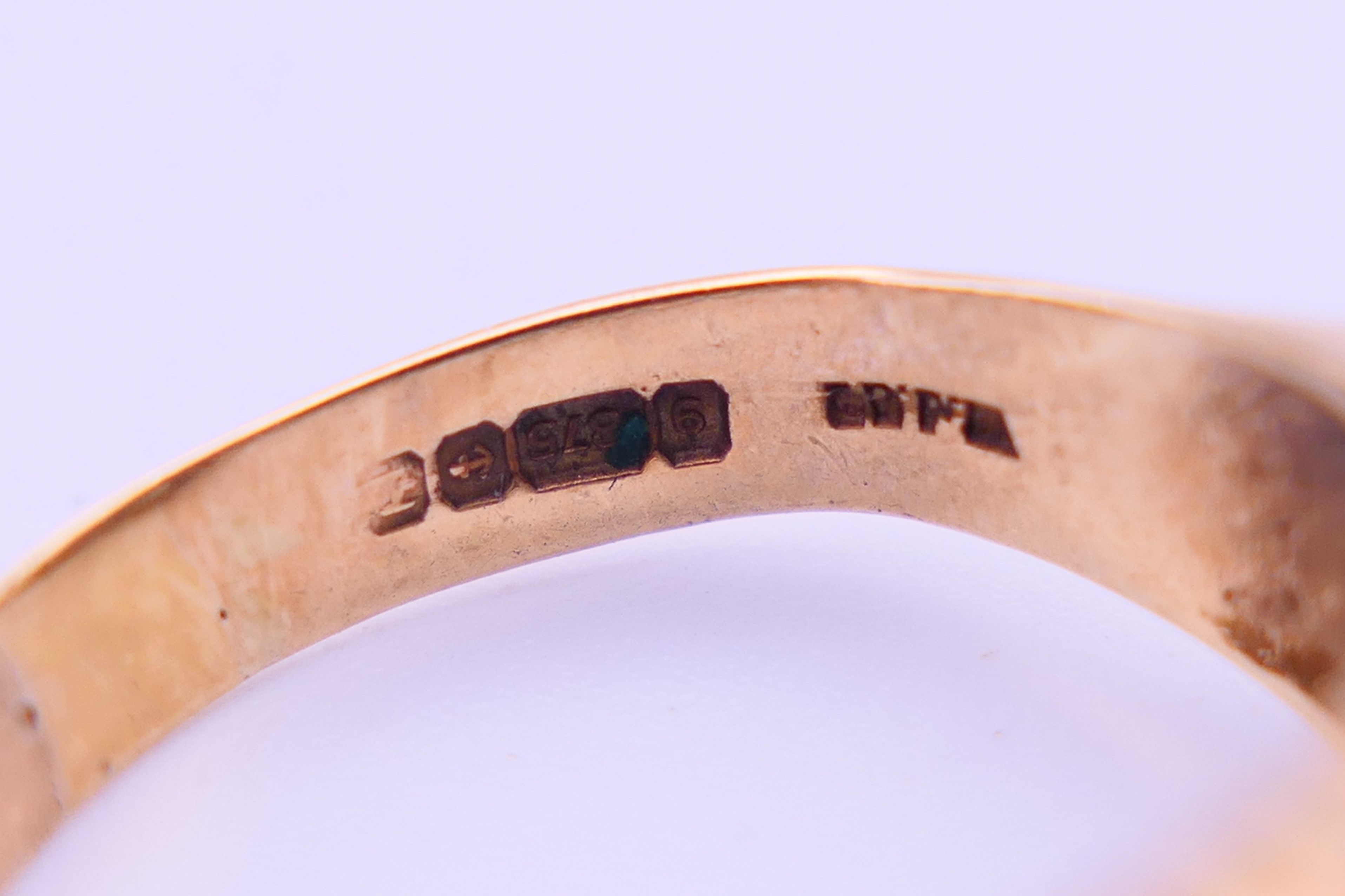 A 9 ct gold, opal and sapphire ring. Ring size Q. 4.8 grammes total weight. - Image 4 of 5