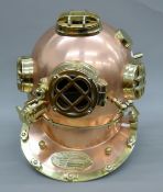 A copper and brass model of a diver's helmet. 42 cm high.