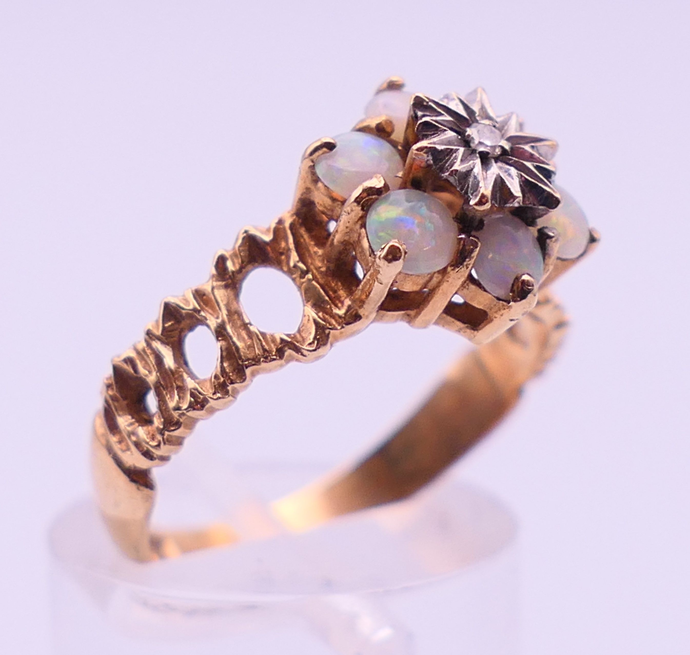 A 9 ct gold, diamond and opal ring. Ring size P/Q. 3.3 grammes. - Image 3 of 5