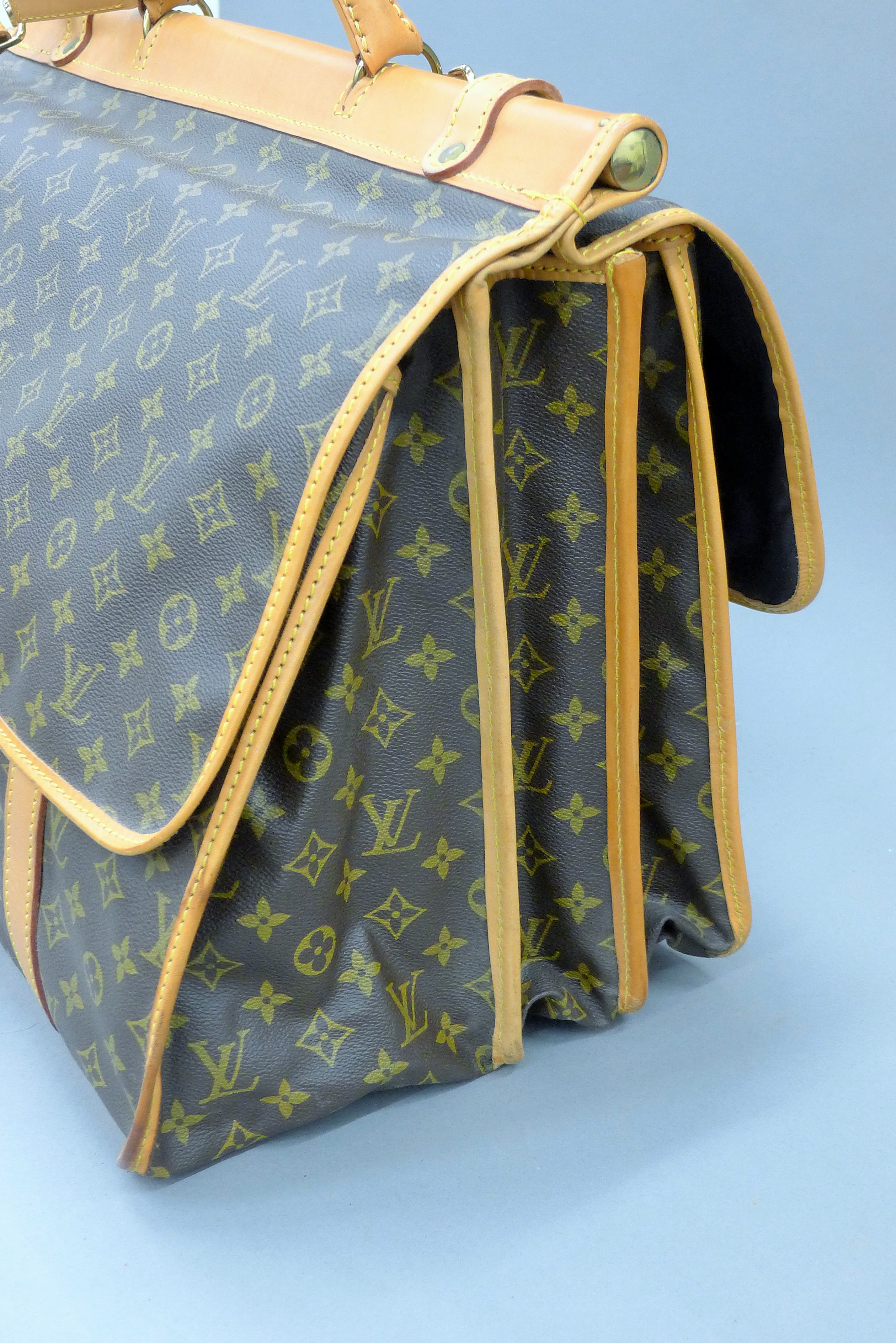 A vintage 1980's Louis Vuitton three-pocket travel bag with leather trim and shoulder strap. - Image 8 of 16