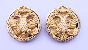A pair of silver double headed eagle cufflinks. Each 2.5 cm diameter.