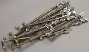A quantity of brass Victorian window stays. The largest 48 cm long.