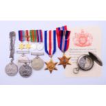 A collection of WWII medals and a Negretti and Zambra compass.