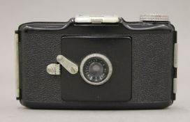 A Kodak Bantam F.8 (Eastman Kodak) camera in original box. The box 12.5 cm long.