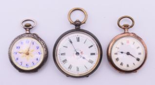 Three silver pocket watches. The largest 3.5 cm diameter.