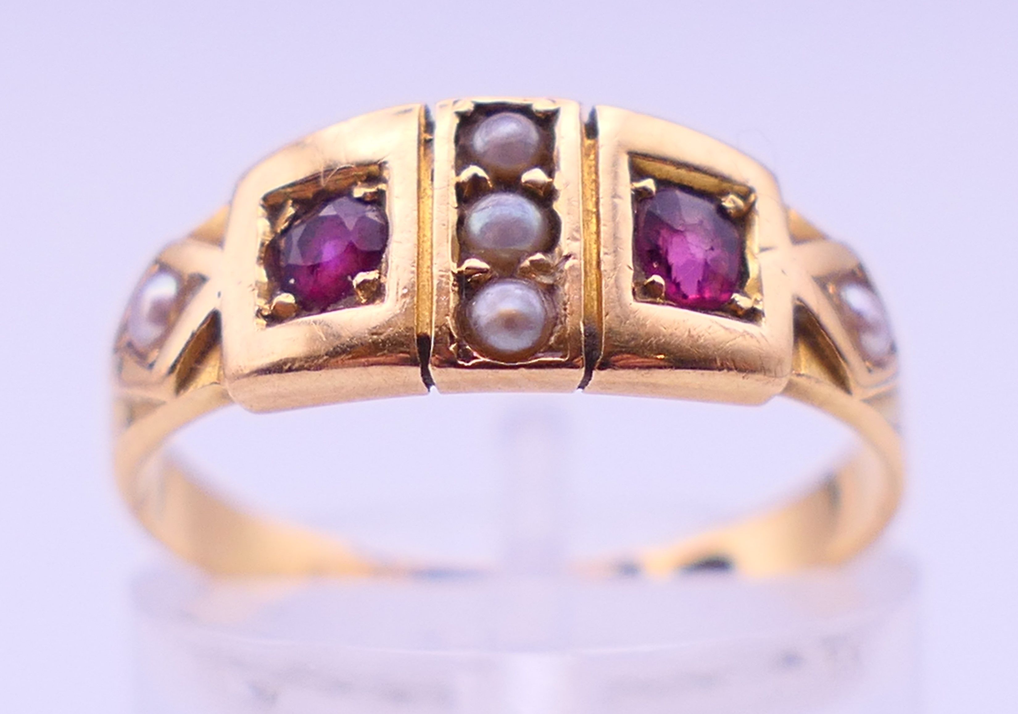 An 18 ct gold, ruby and seed pearl ring. Ring size M. 3.2 grammes total weight. - Image 2 of 5