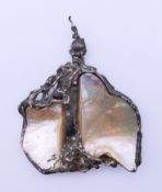 An unmarked silver and mother-of pearl Brutalist style pendant possibly by or in the manner of