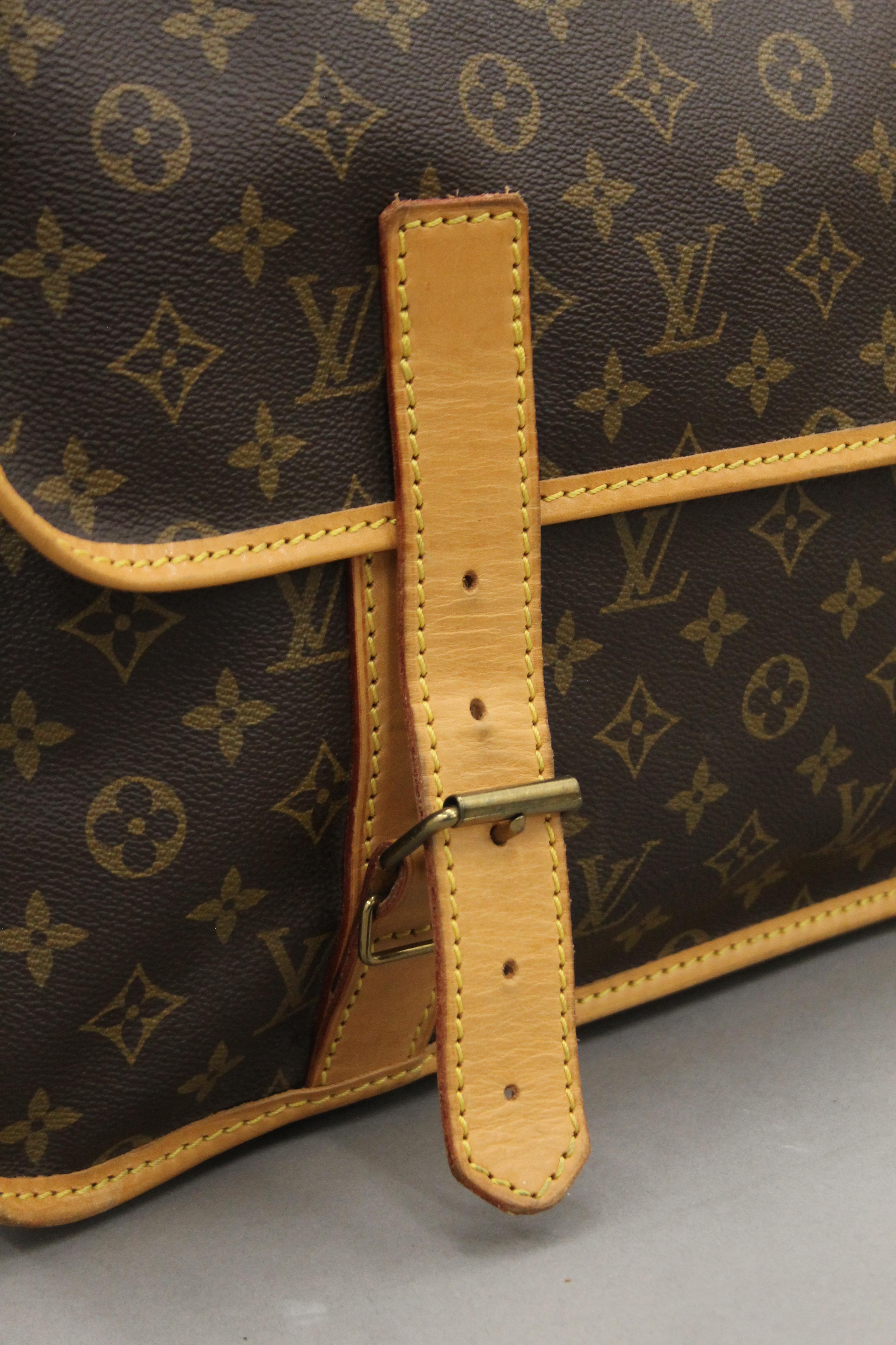 A vintage 1980's Louis Vuitton three-pocket travel bag with leather trim and shoulder strap. - Image 3 of 16