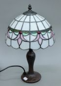 A Tiffany-style lamp. 43 cm high.