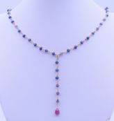 A sapphire and ruby necklace. 40 cm long.
