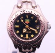 A Tag Heuer ladies' wristwatch. 3 cm wide including crown.