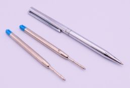 A Dupont ballpoint pen with two Rolex refills. Pen 13.5 cm long.