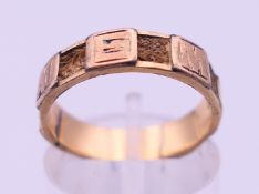 A 9 ct gold 'MEMORY' mourning ring. Ring size K/L. 1.7 grammes total weight.