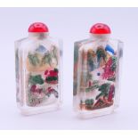 A pair of Chinese glass snuff bottles. Each 7.5 cm high.