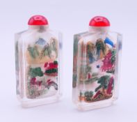 A pair of Chinese glass snuff bottles. Each 7.5 cm high.