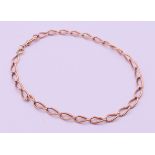 A 9 ct gold watch chain. 42 cm long. 30.1 grammes.